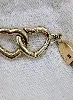 louis vuitton bracelet say yes en toile monogram et cuir centré deux coeurs entrelacés en métal doré