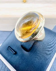 bague or ornée d'une citrine en cabochon (rayures) or 750 millième (18 ct) 14,52g