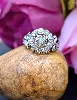 bague centrée d'un diamant en 0,15 carats taille brillant et 12 petits diamants taille rose or 750 millième (18 ct) 3,52g