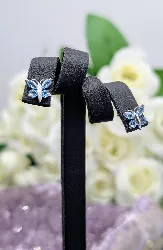 boucles d'oreilles or blanc forme papillon sertis de topaze bleue or 750 millième (18 ct) 0,99g