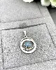 pendentif doule cercles orné d'une pierre bleu argent autre 2,04g